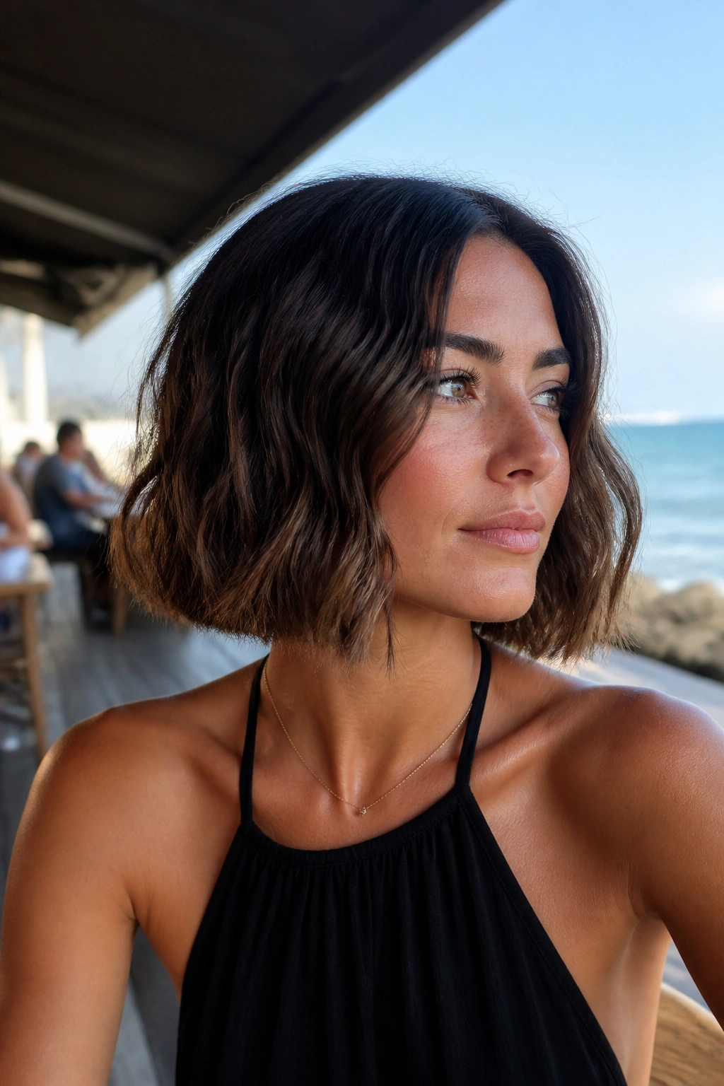 Real woman with wavy blunt bob showing mid-length waves and sharp ends