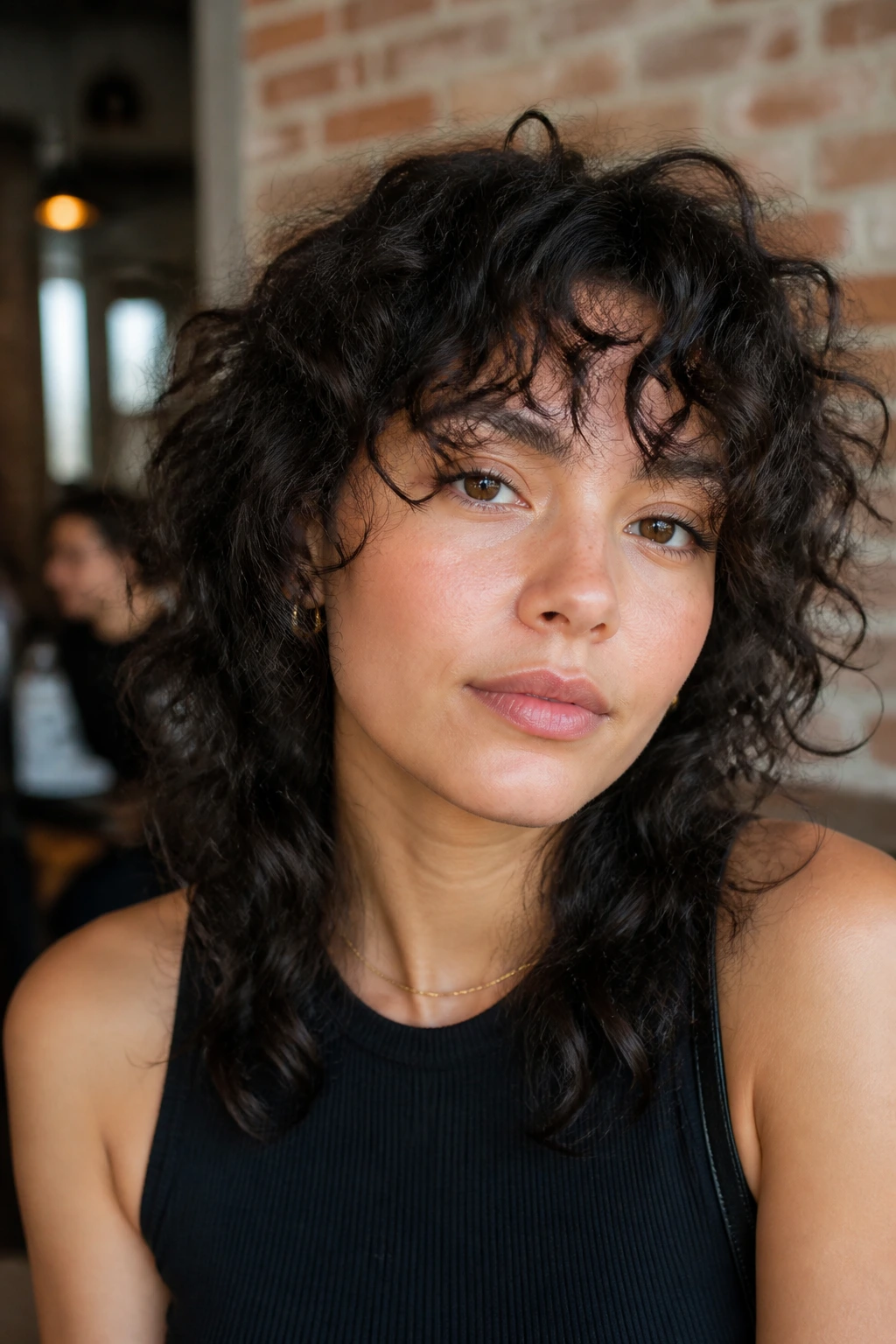 Close-up of a real person with wolf-cut bangs blending into layers