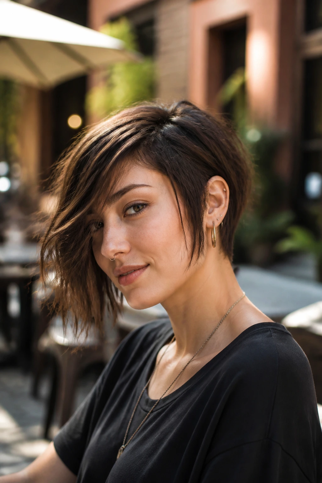 Portrait of real person with choppy asymmetrical bob in a city cafe
