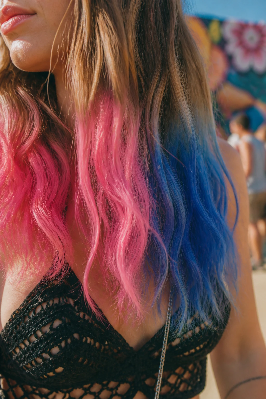 Close-up of two-tone pink and blue hair ends at festival