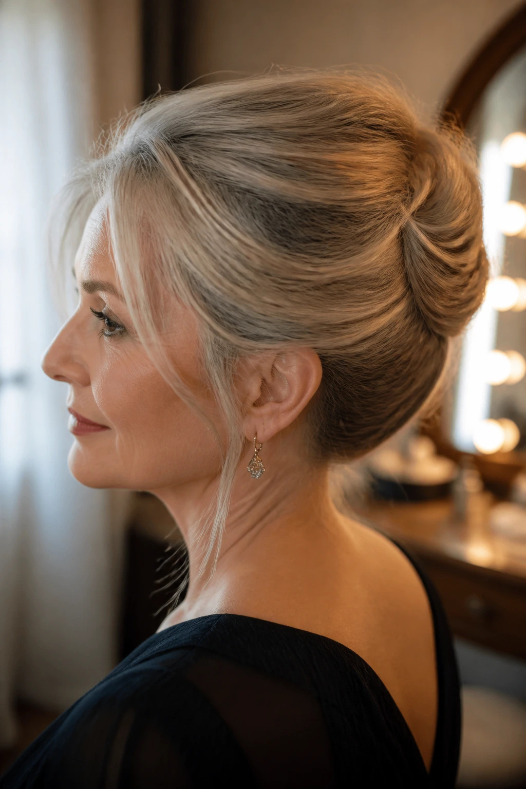 Close-up of a real woman with a classic French twist hairstyle in warm window light