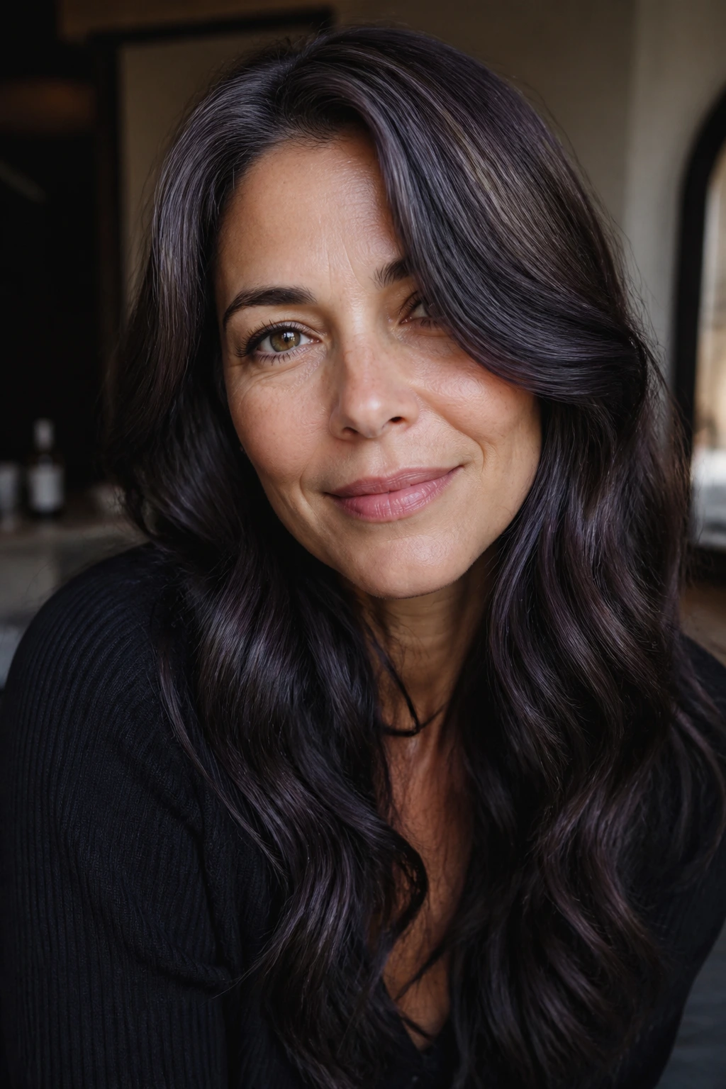 Close-up portrait of a real woman with smokey chocolate hair